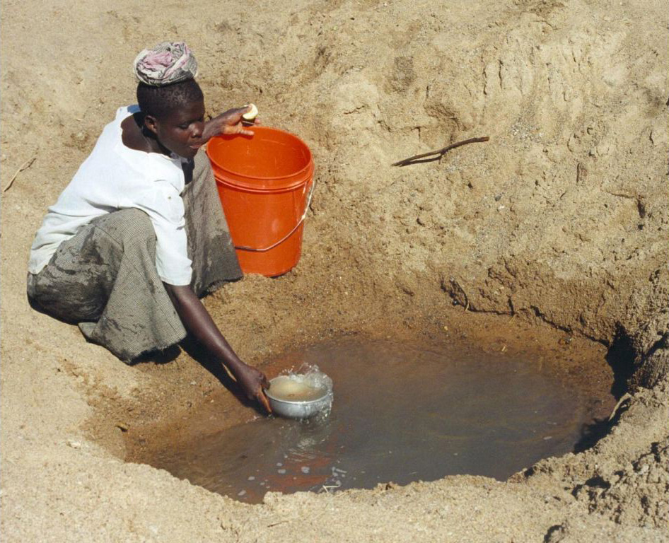 Villagers pumping water from borehole