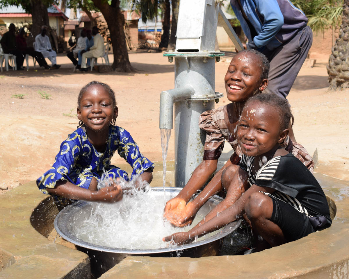 Women drinking water in Africa