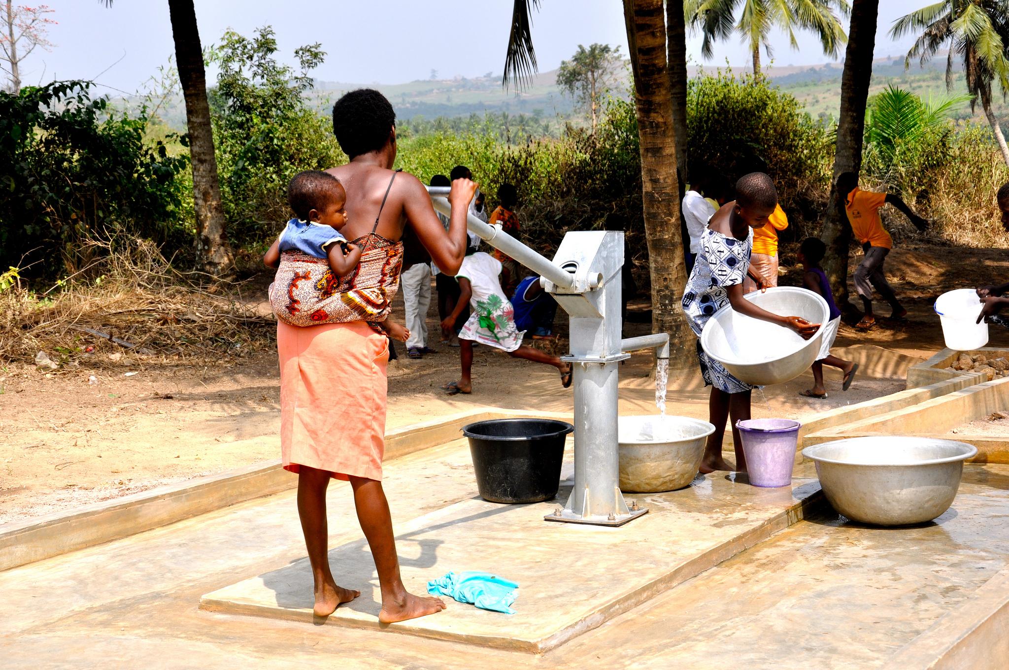 Children fetching water at pump